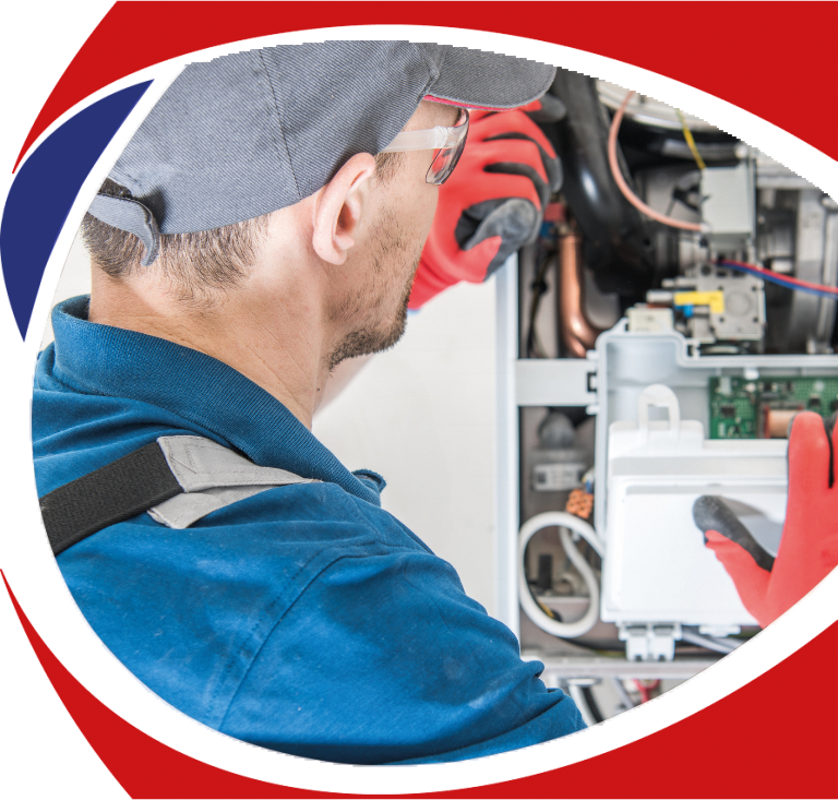 Technician in blue uniform inspecting heating system components, emphasizing professional heater repair services by Comfort Plus Heating & Cooling in Troy, MI.