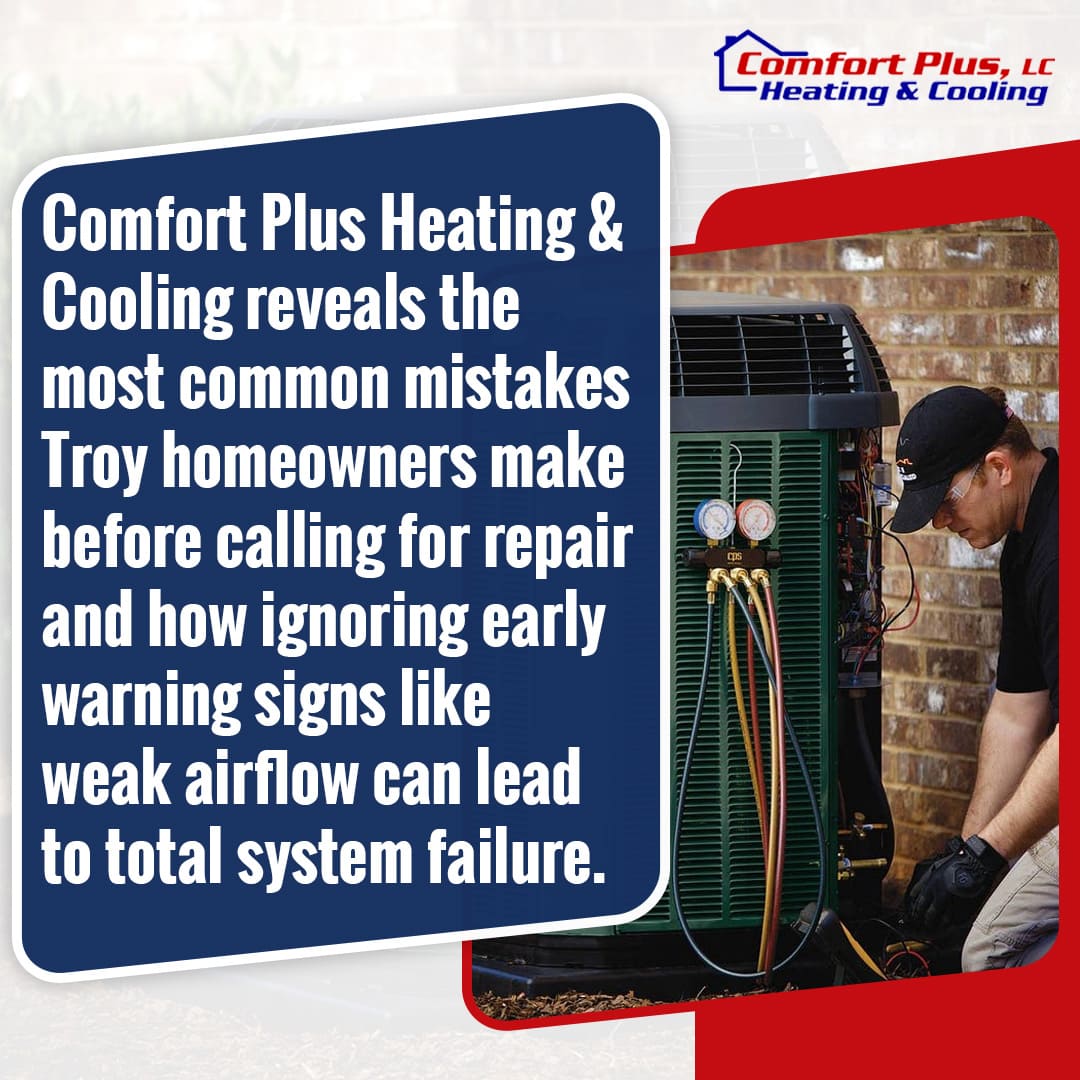 HVAC technician inspecting AC system gauges to diagnose airflow issues and prevent system failure in residential unit